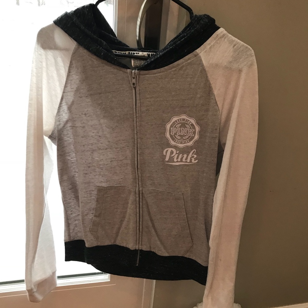 Pink hoodie that’s grey and white.